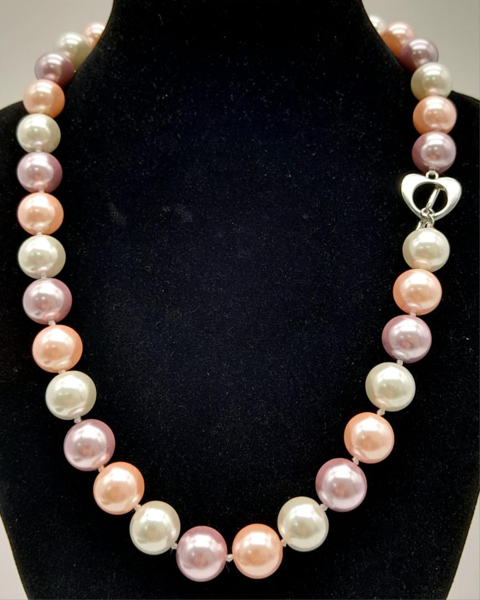 A South Sea Pearl Shell Pastel Coloured Bead Necklace. 12mm beads. 44cm necklace length.