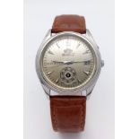 A Vintage Orient Day Pointer Automatic Gents Watch. Brown leather strap. Stainless steel case -