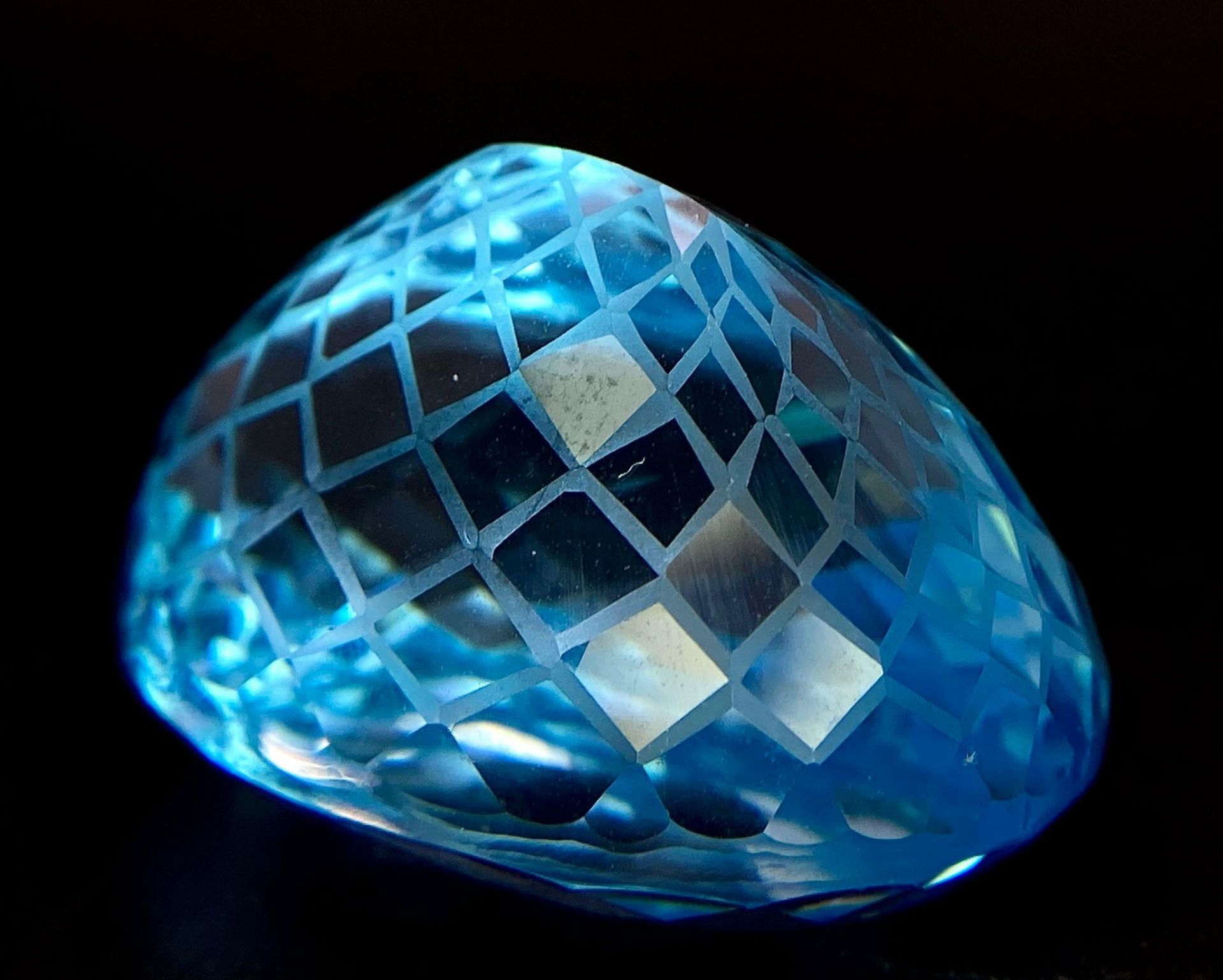A 92.96ct Blue Topaz Gemstone, in Oval Flower Laser Cut. Comes with the GFCO Swiss Certificate
