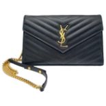 A Saint Laurent Black Leather Flap Handbag. Decorative chevron exterior with gold furniture. YSL