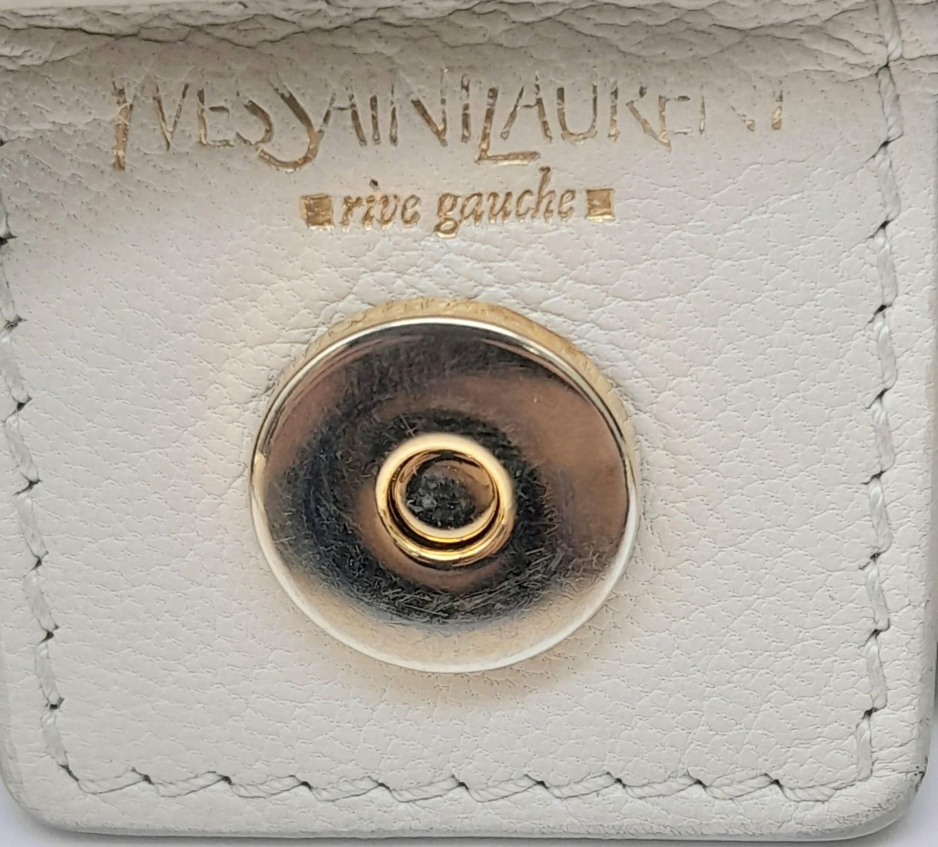 A YSL Saint-Tropez Leather Double Horn Hobo Bag. Ivory leather strip exterior. Horn shaped - Image 6 of 8