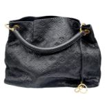 A Louis Vuitton Monogram Black Snakeskin Tote Bag. Gold tone hardware. Spacious black leather