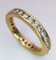 AN 18K YELLOW GOLD DIAMOND SET FULL ETERNITY BAND RING. APPROX 1CT. 4G. SIZE M 1/2