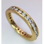 AN 18K YELLOW GOLD DIAMOND SET FULL ETERNITY BAND RING. APPROX 1CT. 4G. SIZE M 1/2