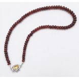A 250ctw Garnet Rondelle Gemstone Necklace with Citrine Clasp set in 925 Silver. 42cm length. 49.