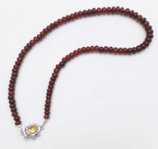 A 250ctw Garnet Rondelle Gemstone Necklace with Citrine Clasp set in 925 Silver. 42cm length. 49.