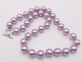 A Metallic Lavender South Sea Pearl Shell Bead Necklace. 12mm beads. 45cm necklace length.