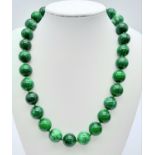 A Chinese Green and White Jade Bead Necklace. 14mm beads. 42cm necklace length.
