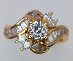 AN 18K YELLOW GOLD FANCY MIX CUT DIAMOND CLUSTER RING. 1.20CT. 4.4G. SIZE O