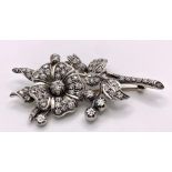 An Antique 18K Gold and Diamond Floral Brooch. This beautifully constructed masterpiece has a