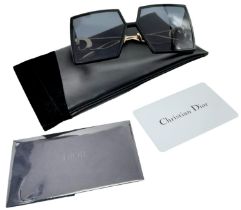 A Pair of Fashionable Designer Christian Dior Sunglasses. Comes with case original box. Ref: 15840