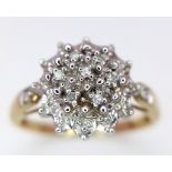 A 9K YELLOW GOLD DIAMOND CLUSTER RING. 2.5G. SIZE M