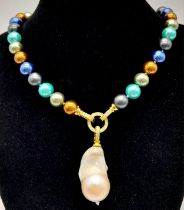 A Colourful South Sea Pearl Shell Necklace with Hanging Large Baroque Pearl. Gilded and white