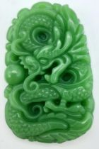 A Chinese Green Jade Decoratively Carved Dragon Pendant. 5.5cm