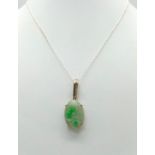 A Vintage Sterling Silver Carved Jadeite Pendant Necklace. 50cm Length Sterling Silver Chain.