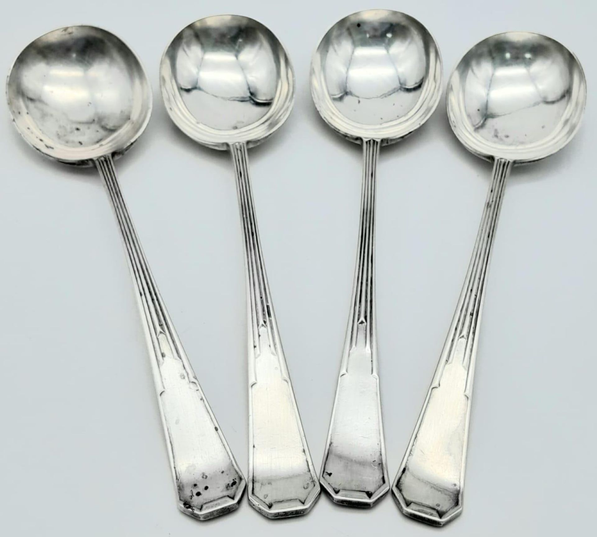 Four 1937 Sheffield Sterling Silver Serving Spoons. Full UK hallmarks. 327g total weight. 20cm