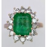 AN 18K WHITE GOLD DIAMOND & EMERALD CLUSTER RING. 0.50CT DIAMONDS & APPROX 2CT EMERALD. 3.6G. SIZE M