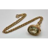 An Antique 9K Gold Fob Seal Citrine Gemstone Pendant on a 9K Gold Chain. Pendant - 3cm. Chain -