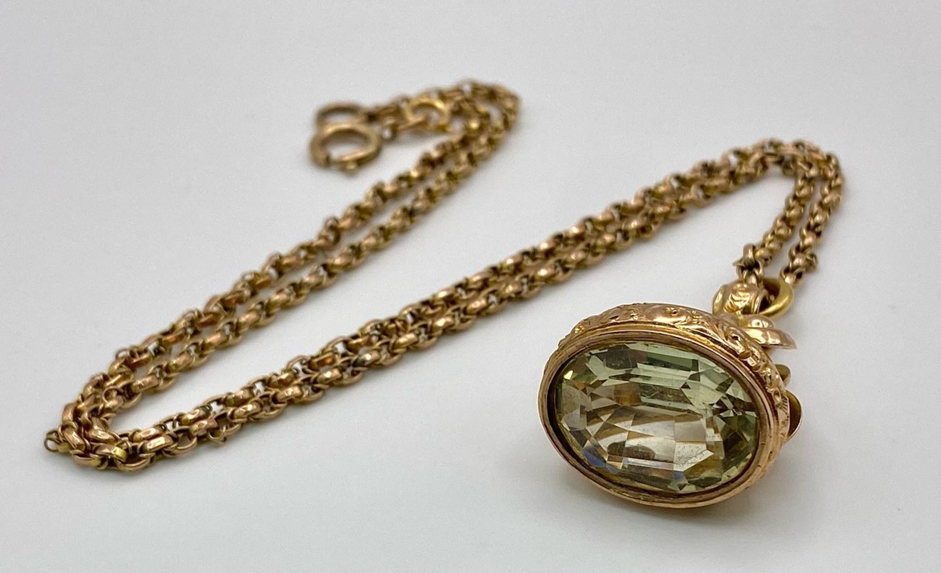An Antique 9K Gold Fob Seal Citrine Gemstone Pendant on a 9K Gold Chain. Pendant - 3cm. Chain -