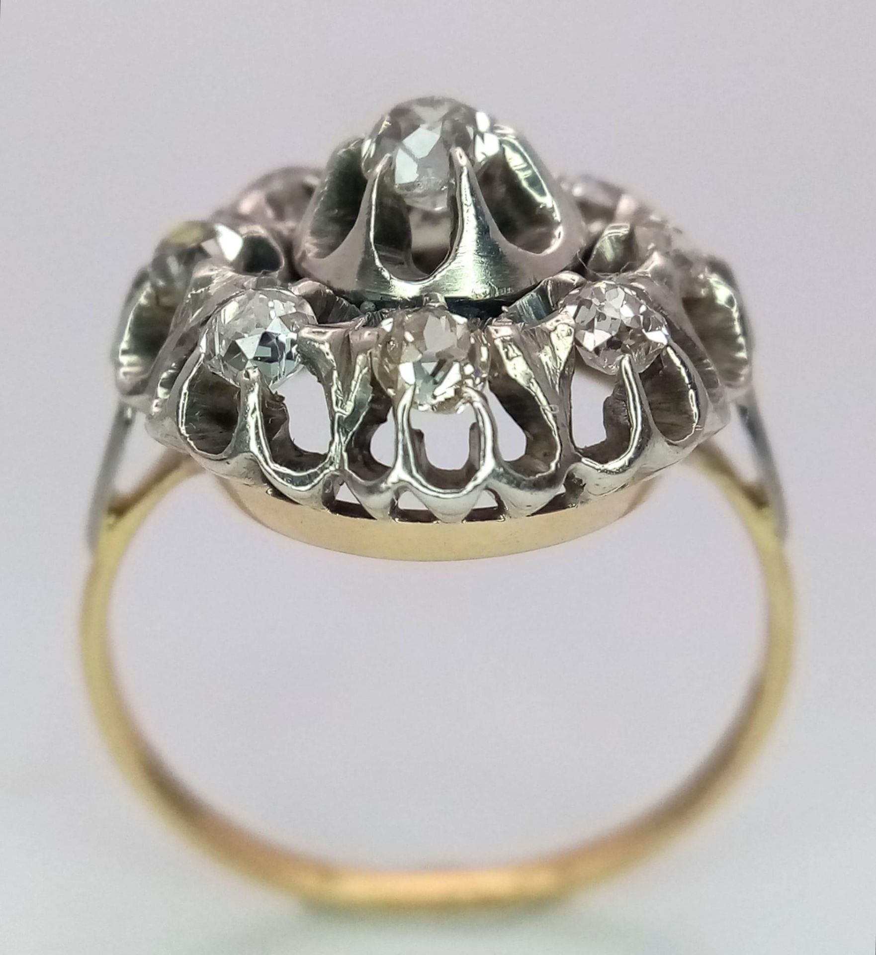 An 18K Yellow and White Gold Diamond Ring. Central brilliant round cut diamond with an eight - Image 7 of 9