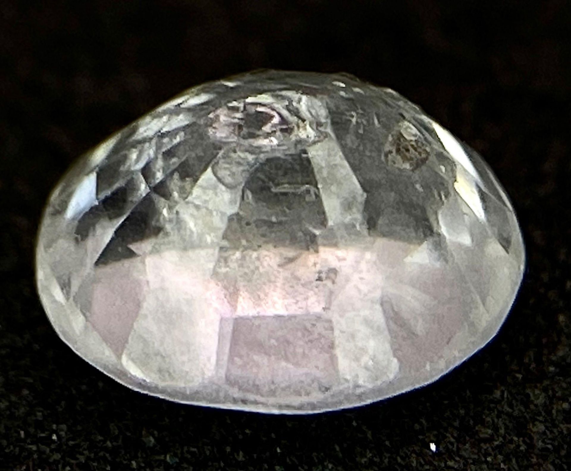 A 0.78ct Madagascar Natural White Sapphire, in the Oval Faceted cut. Comes with the AIG Certificate. - Image 4 of 6