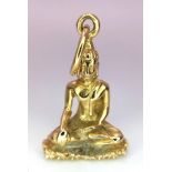 A 9 K yellow gold pendant of a sitting Buddha in the lotus position meditating. Height (with