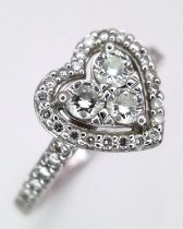 A PLATINUM DIAMOND CLUSTER RING IN THE SHAPE OF A HEART - 0.63CT. 5.3G. SIZE P