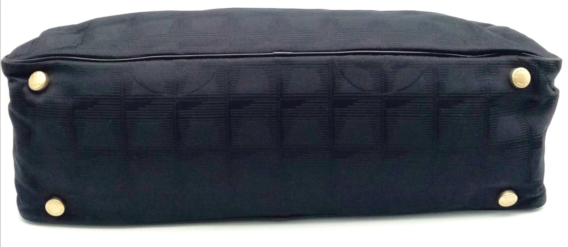 A Chanel Black Travel Line Bag. Canvas exterior with leather straps, four protective base studs - Image 5 of 14