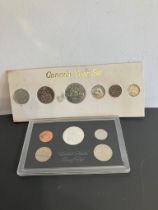 Sets of USA and Canadian Coins to include Kennedy‘Silver’Half dollar and a Canadian Voyager dollar.