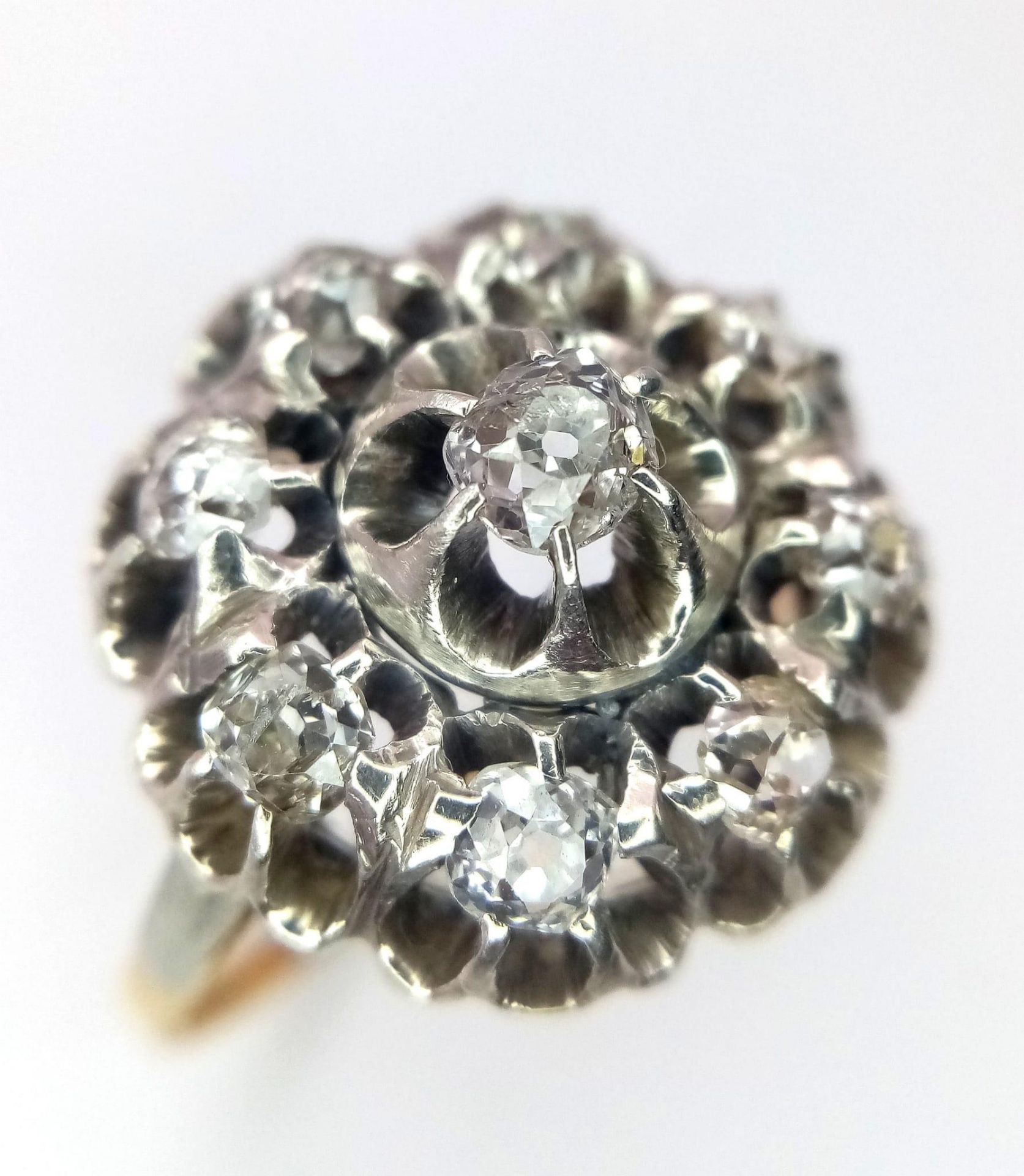 An 18K Yellow and White Gold Diamond Ring. Central brilliant round cut diamond with an eight - Image 2 of 9