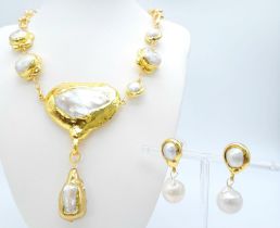 A glamorous and unusual necklace and earrings set with large baroque natural pearls. Necklace