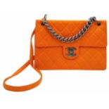 A Chanel Quilted Orange Caviar Leather Shoulder Bag. Quilted pattern exterior with gunmetal