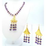 A very glamorous amethyst necklace and earrings set with lavishly gold-filled parts. Necklace