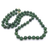 Long Green Jade Beaded Necklace. Measuring 68cm in length, this necklace is filled with rich green