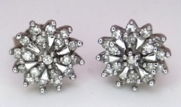 A PAIR OF 9K YELLOW GOLD DIAMOND SET CLUSTER STUD EARRINGS. 1.5G