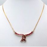A very elegant 14 K yellow gold chain necklace with a central part loaded with rubies and diamonds