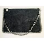 A Stella McCartney Falabella Black Suede Handbag. Silver tone hardware. Burgundy textile interior.