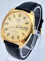 A Vintage Camy Club Star Gents Watch. Black leather strap. Gilded case - 36mm. Gold tone dial with