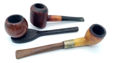 Three old pipes. Including one in the form of a Tennis racket.