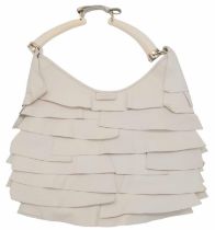 A YSL Saint-Tropez Leather Double Horn Hobo Bag. Ivory leather strip exterior. Horn shaped