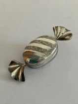 Vintage SILVER PILL BOX in the unusual form of a Wrapped Toffee. Full UK hallmark.