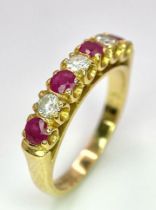 A 9 K yellow gold ring with round cut rubies alternating with round cut diamonds. Ring size: J,