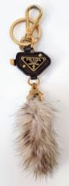 A Prada Furry Key Ring! Gilded hardware with a tough leather body and furry finish. Comes with a