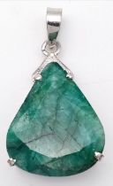 An Emerald Silver Pendant. Drop cut set in 925 Sterling silver. 40 Ct. W-23.30g. 5cm. Comes with a