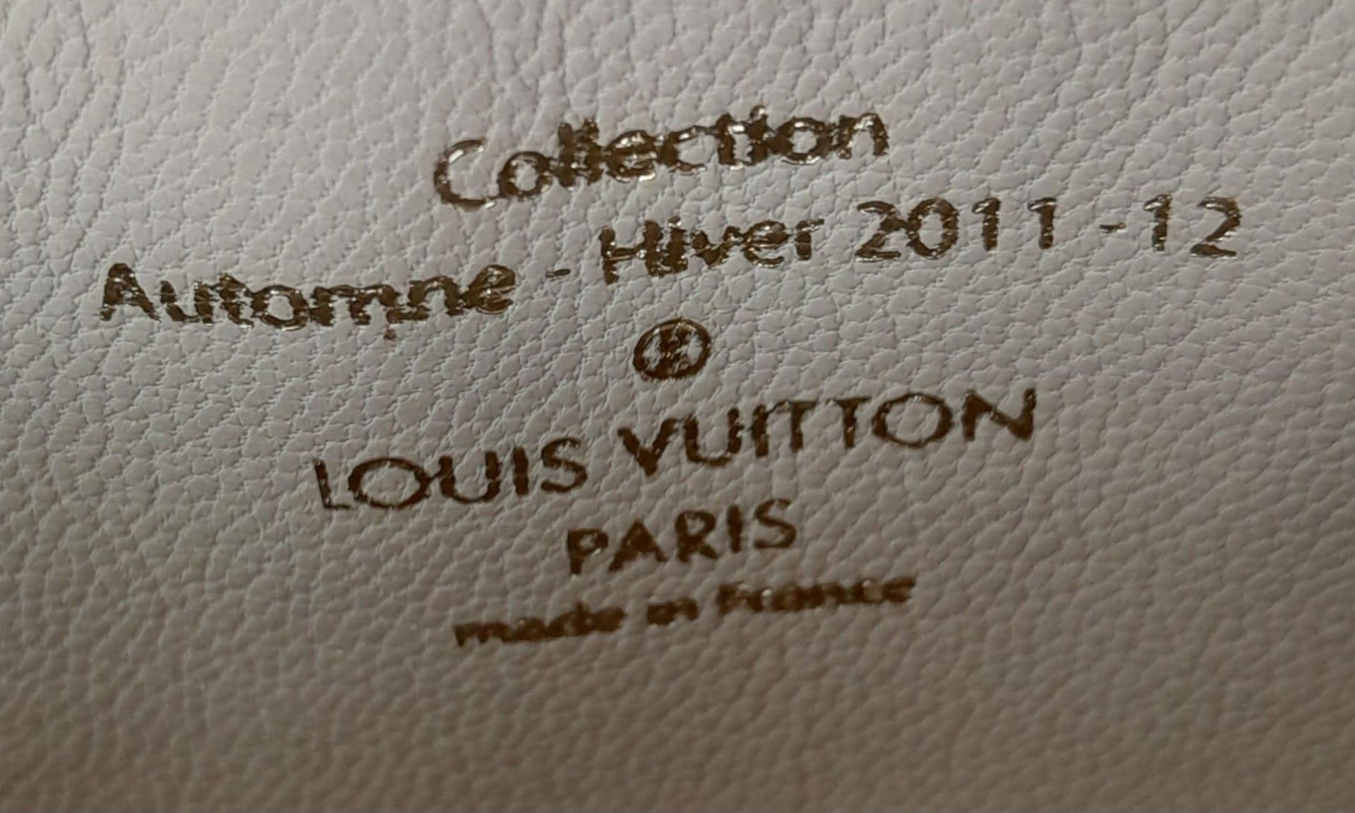 A Louis Vuitton Lockit Fetish Clutch Bag. Monogram canvas with gold tone hardware. Lock and keys. - Image 7 of 7
