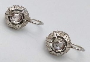A Pair of Art Deco Style White Gold and Diamond Stud Earrings. 2.51g total weight.