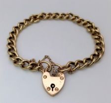 A HEAVY 9K GOLD INTERLINK BRACELET WITH HEART PADLOCK AND SAFETY CHAIN . 22.6gms 18cms
