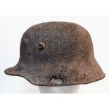 WW1 Battle Damaged German M16 Stahlhelm Helmet. This helmet was found in woodland in the Ypres