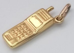 A 9K YELLOW GOLD MOBILE PHONE CHARM. 1G
