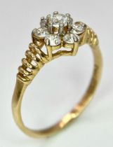 A very showy 14 K yellow gold ring with a cluster of Cubic Zirconia on top. Ring size: N1/2, weight: